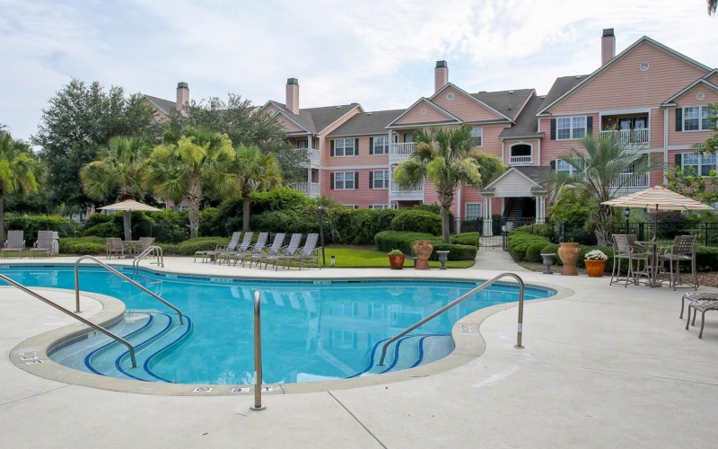 a swimming pool in front of a house